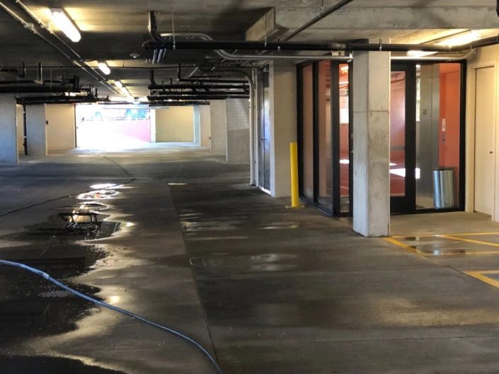 A parking garage with a lot of concrete floors